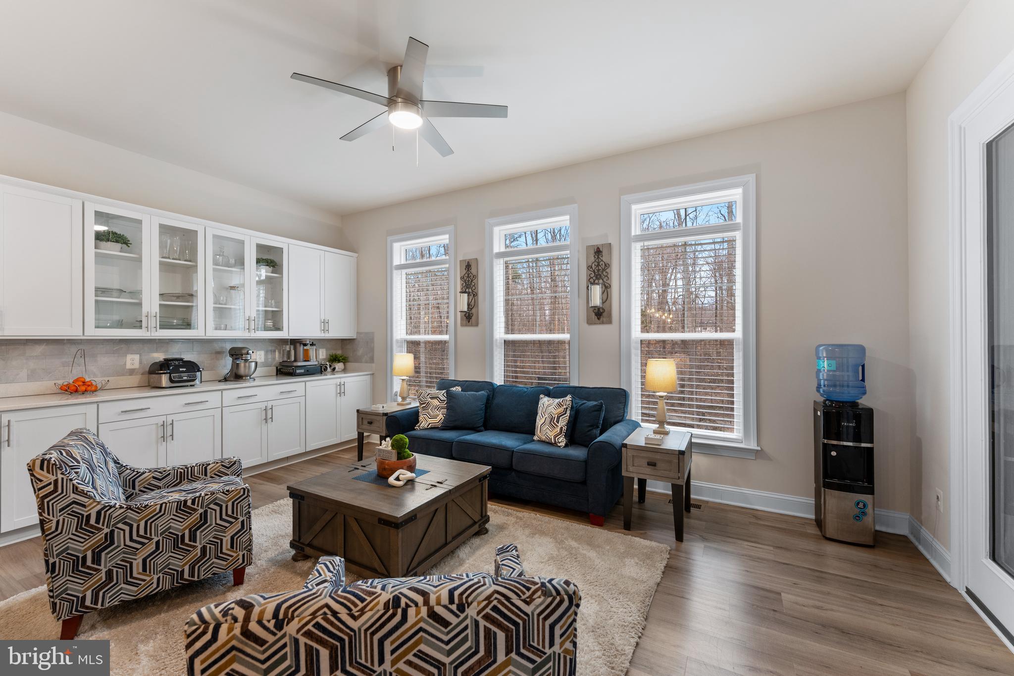 13882 Trinity Pond Lane Manassas, VA 20112 - Photo 18 of 69 a living room with furniture and a large window