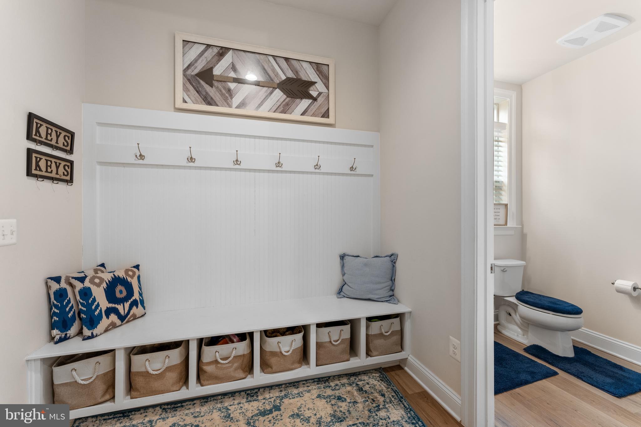 13882 Trinity Pond Lane Manassas, VA 20112 - Photo 20 of 69 a view of a hallway with paintings on the wall