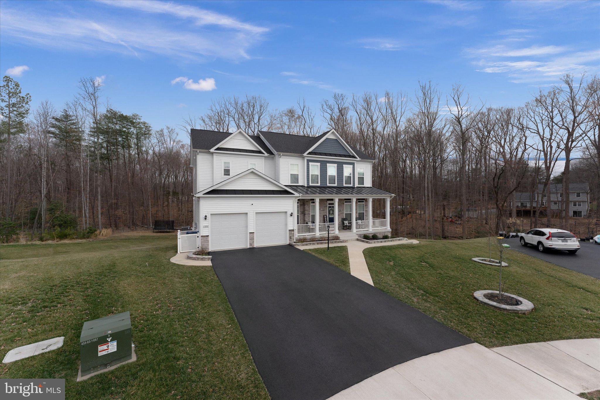 13882 Trinity Pond Lane Manassas, VA 20112 - Photo 2 of 69 a view of a house with backyard and trees