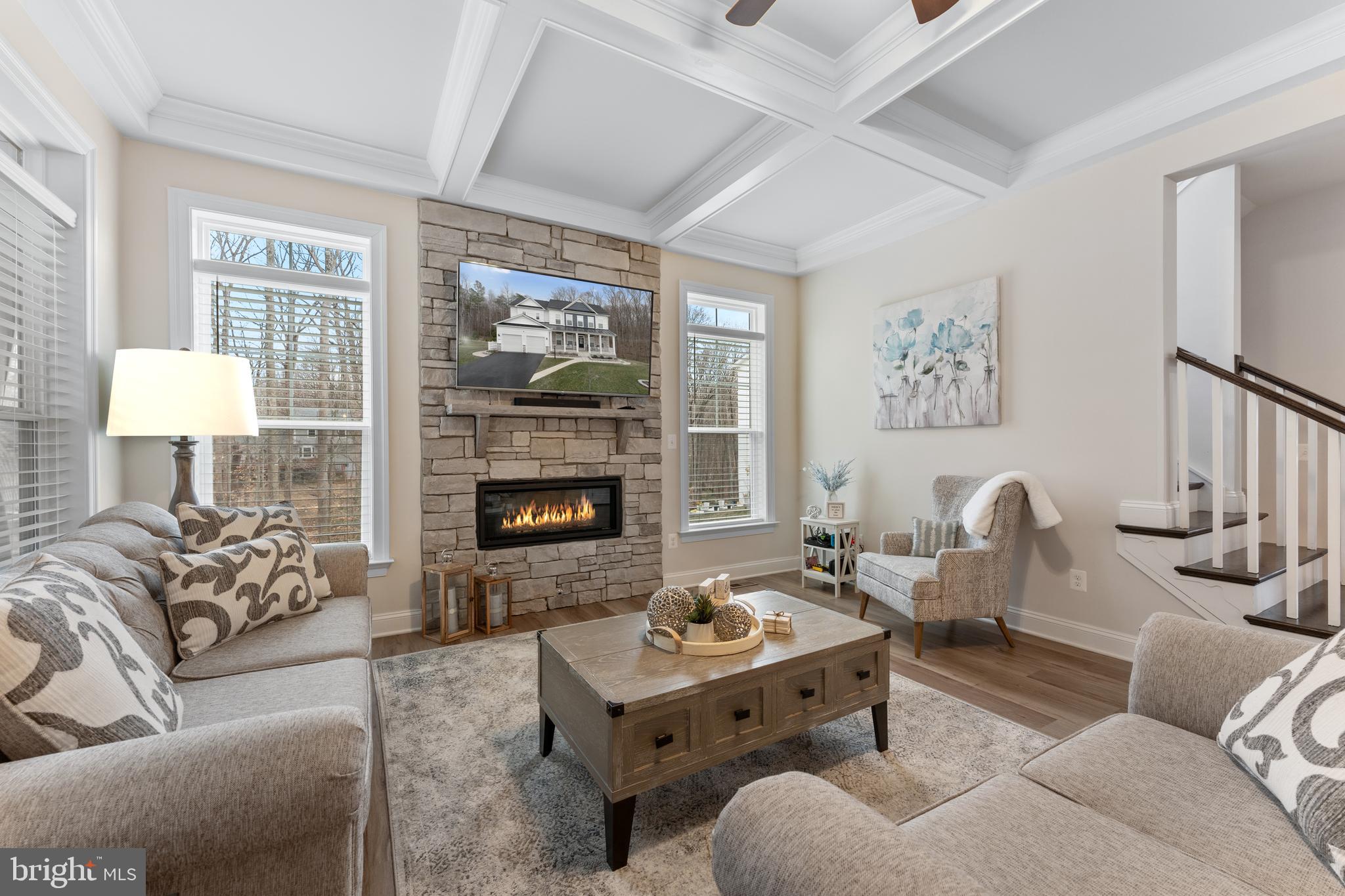 13882 Trinity Pond Lane Manassas, VA 20112 - Photo 24 of 69 a living room with furniture and a fireplace