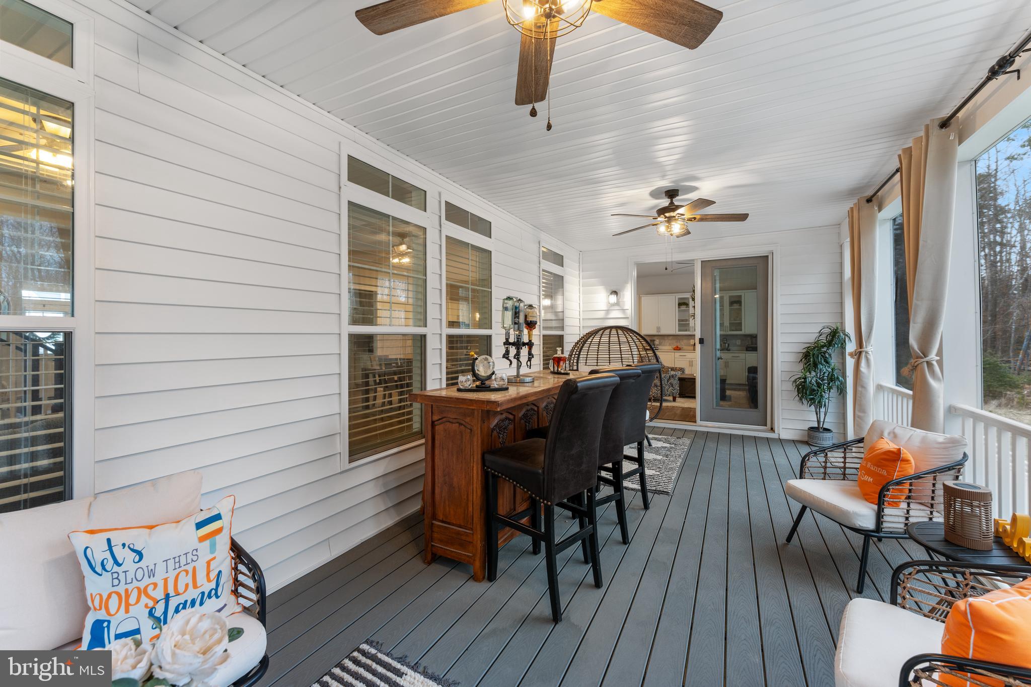 13882 Trinity Pond Lane Manassas, VA 20112 - Photo 31 of 69 a view of a dining room with furniture window and wooden floor