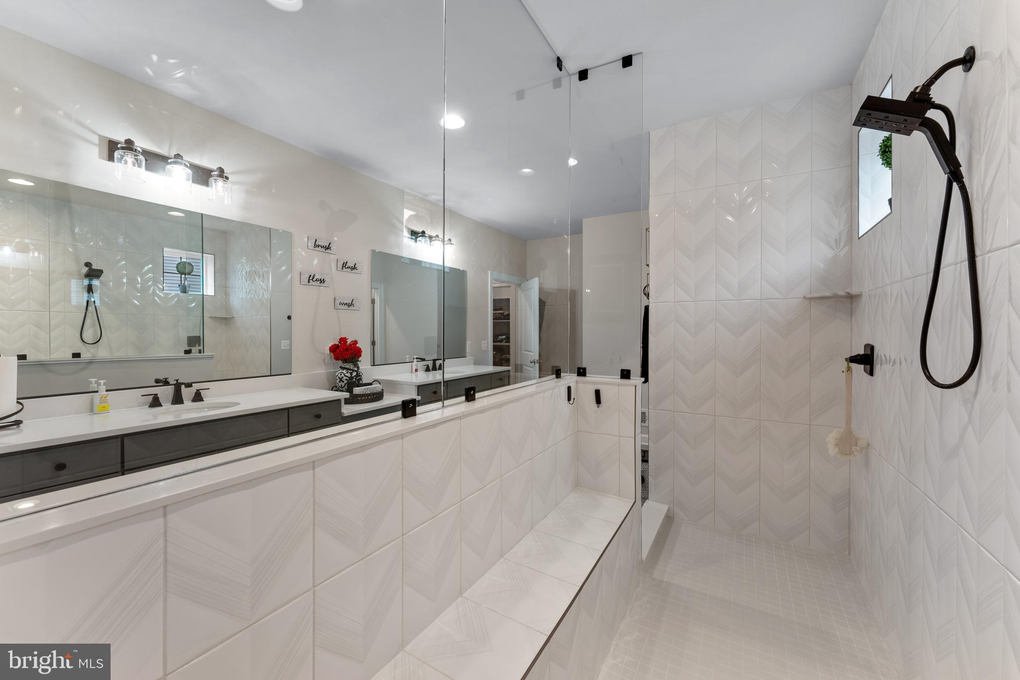13882 Trinity Pond Lane Manassas, VA 20112 - Photo 44 of 69 a bathroom with a tub sink shower and mirror