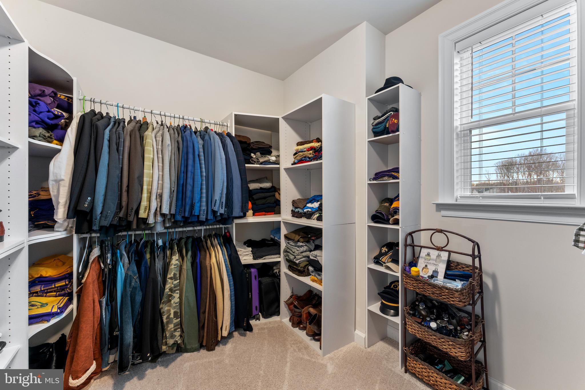 13882 Trinity Pond Lane Manassas, VA 20112 - Photo 46 of 69 a view of walk in closet with clothes and shoes