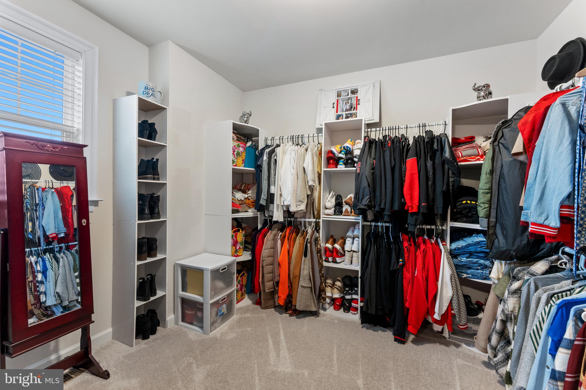 13882 Trinity Pond Lane Manassas, VA 20112 - Photo 47 of 69 a view of walk in closet with clothes