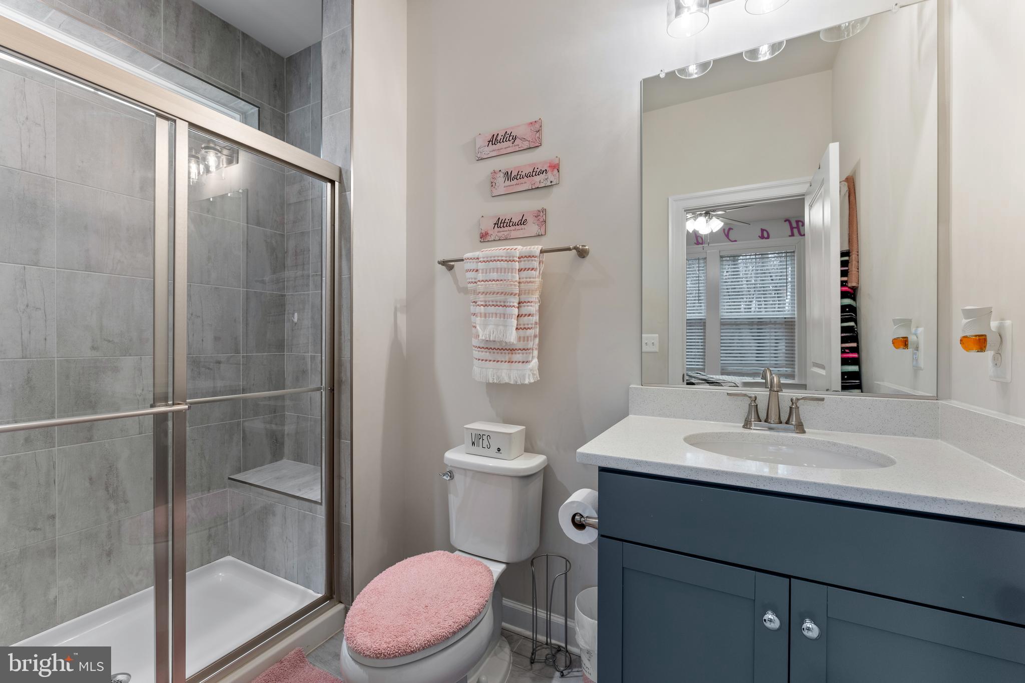13882 Trinity Pond Lane Manassas, VA 20112 - Photo 51 of 69 a bathroom with a sink a toilet a shower and a mirror