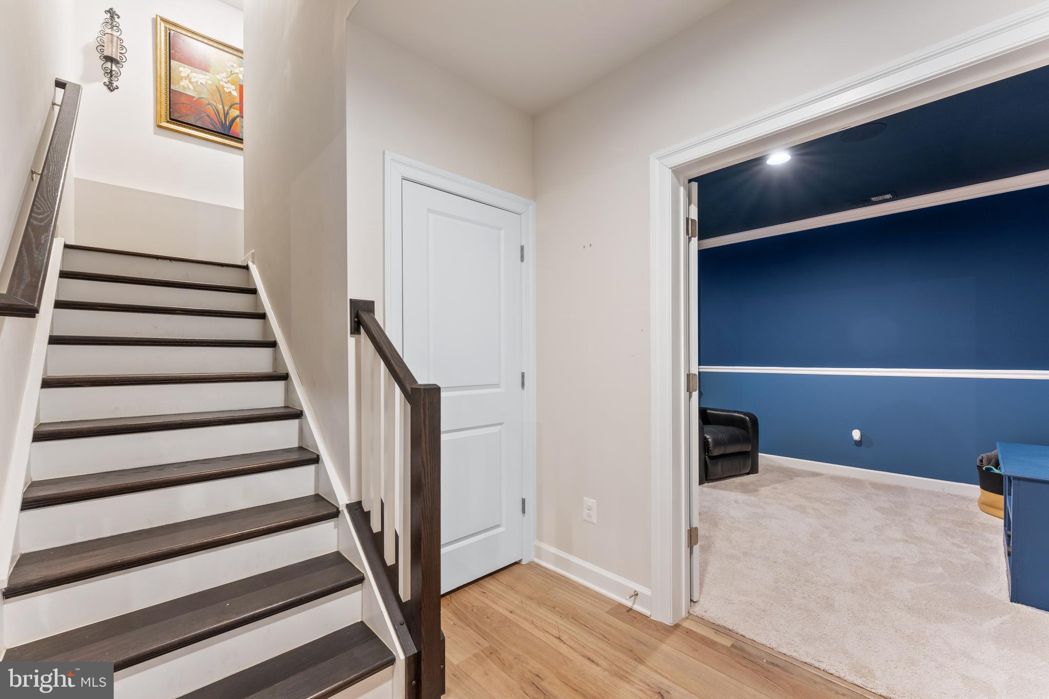 13882 Trinity Pond Lane Manassas, VA 20112 - Photo 53 of 69 a view of an empty room with wooden floor and entryway