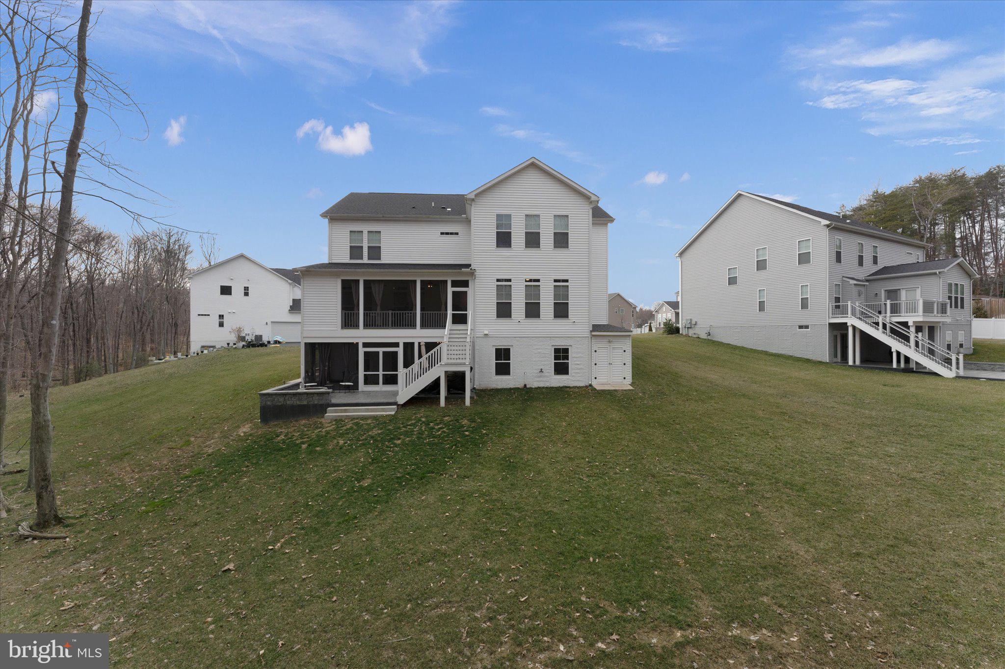 13882 Trinity Pond Lane Manassas, VA 20112 - Photo 66 of 69 a view of a house with a big yard and large trees