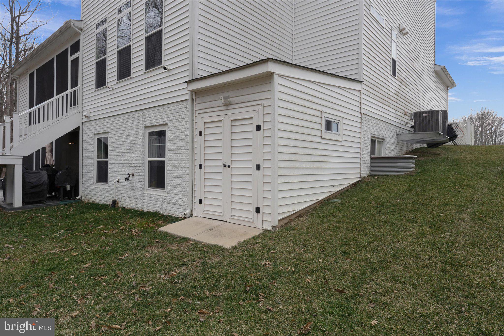 13882 Trinity Pond Lane Manassas, VA 20112 - Photo 67 of 69 a view of a white house with a yard