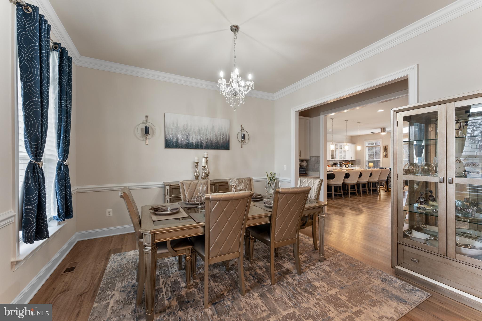 13882 Trinity Pond Lane Manassas, VA 20112 - Photo 10 of 69 a view of a dining room with furniture and wooden floor