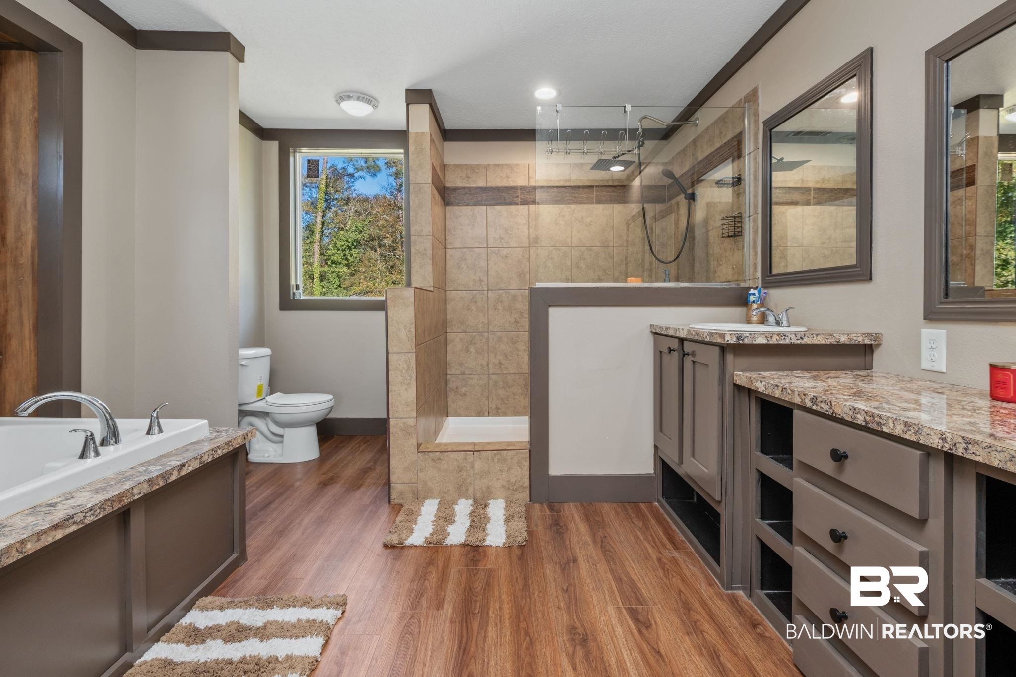 15080 Starlight Avenue Wilmer, AL 36587 - Photo 17 of 29 Full bathroom featuring independent shower and bath, vanity, hardwood / wood-style flooring, and toilet