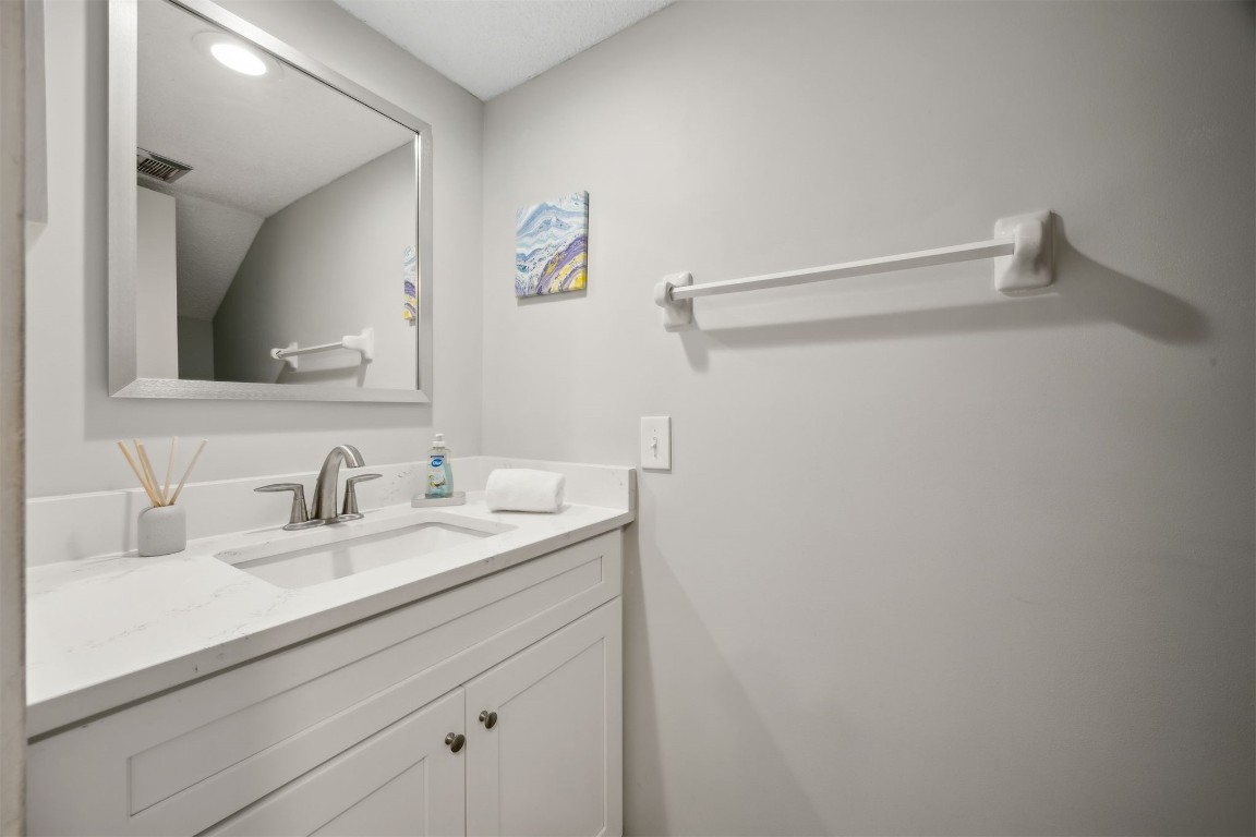 3012 Sea Marsh Road, Unit 3012 Fernandina Beach, FL 32034 - Photo 22 of 54 a bathroom with a sink and a mirror