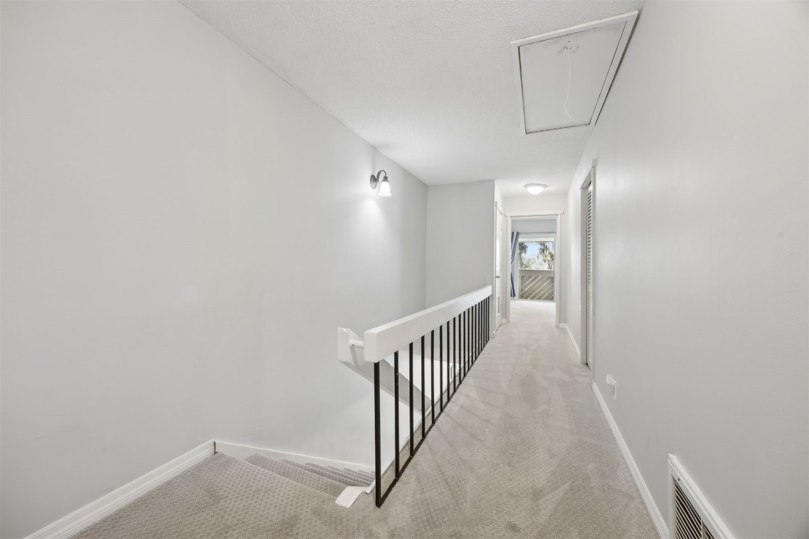 3012 Sea Marsh Road, Unit 3012 Fernandina Beach, FL 32034 - Photo 24 of 54 a view of a hallway with stairs