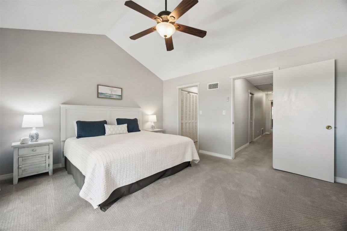 3012 Sea Marsh Road, Unit 3012 Fernandina Beach, FL 32034 - Photo 26 of 54 a spacious bedroom with a bed and a ceiling fan