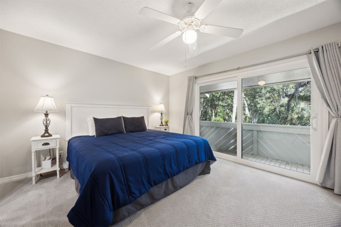 3012 Sea Marsh Road, Unit 3012 Fernandina Beach, FL 32034 - Photo 31 of 54 a bedroom with a large bed and a window