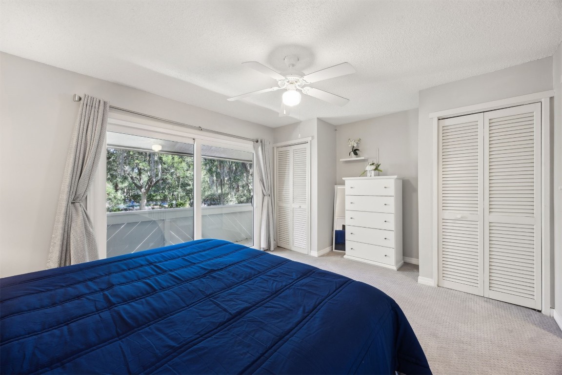 3012 Sea Marsh Road, Unit 3012 Fernandina Beach, FL 32034 - Photo 32 of 54 a bedroom with a bed and a large window