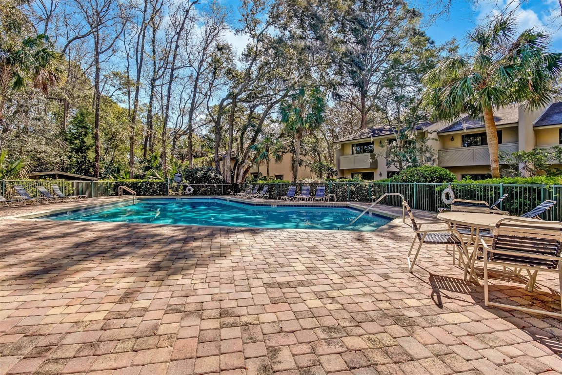 3012 Sea Marsh Road, Unit 3012 Fernandina Beach, FL 32034 - Photo 44 of 54 a view of a yard with plants and trees