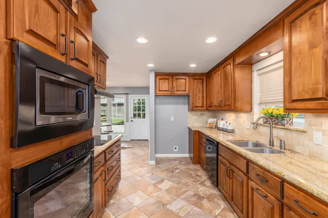 a kitchen with a sink and cabinets
