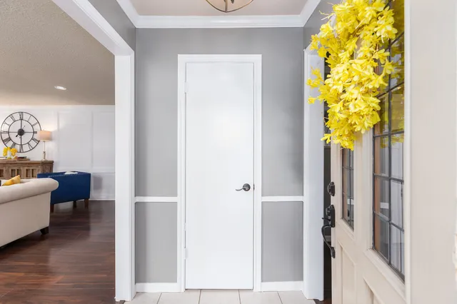 a living room with fireplace furniture and a wooden floor