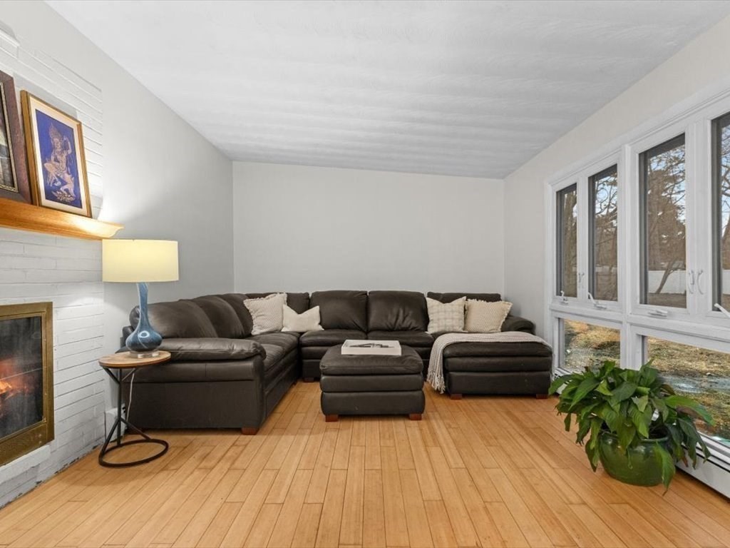 15 Rosslare Road Framingham, MA 01701 - Photo 17 of 37 a living room with furniture and a fireplace