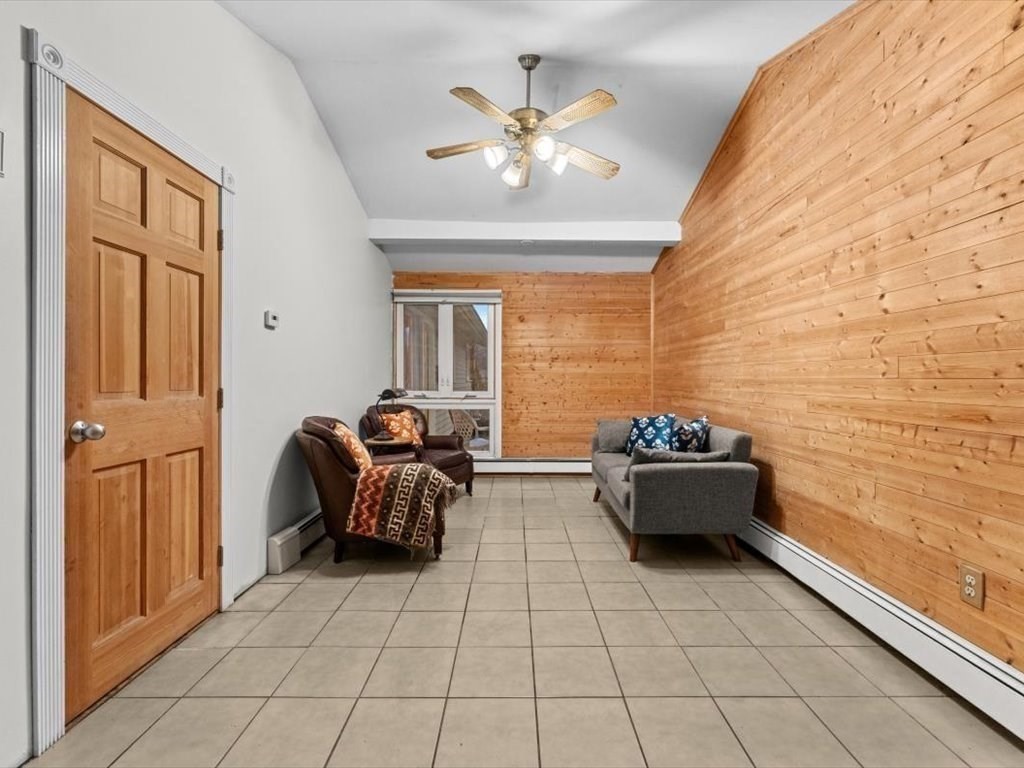 15 Rosslare Road Framingham, MA 01701 - Photo 18 of 37 a living room with furniture and a chandelier