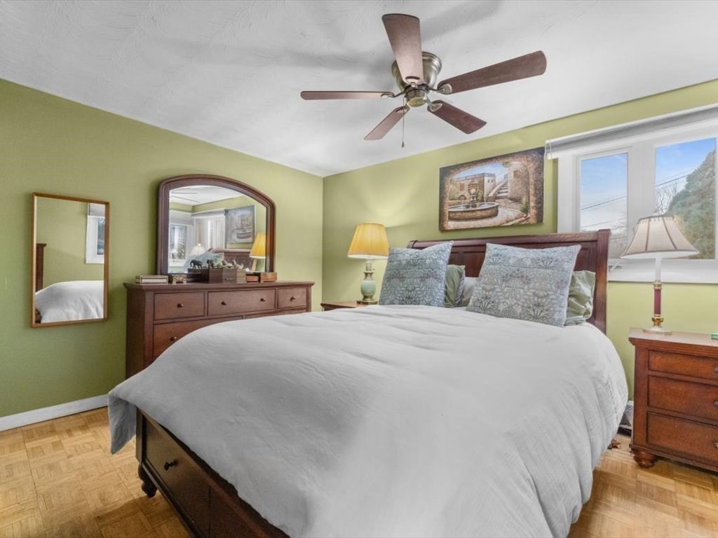 15 Rosslare Road Framingham, MA 01701 - Photo 23 of 37 a bedroom with a bed and a chandelier