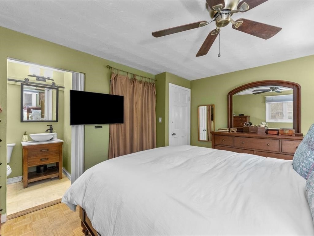 15 Rosslare Road Framingham, MA 01701 - Photo 24 of 37 a bedroom with a bed and a flat screen tv