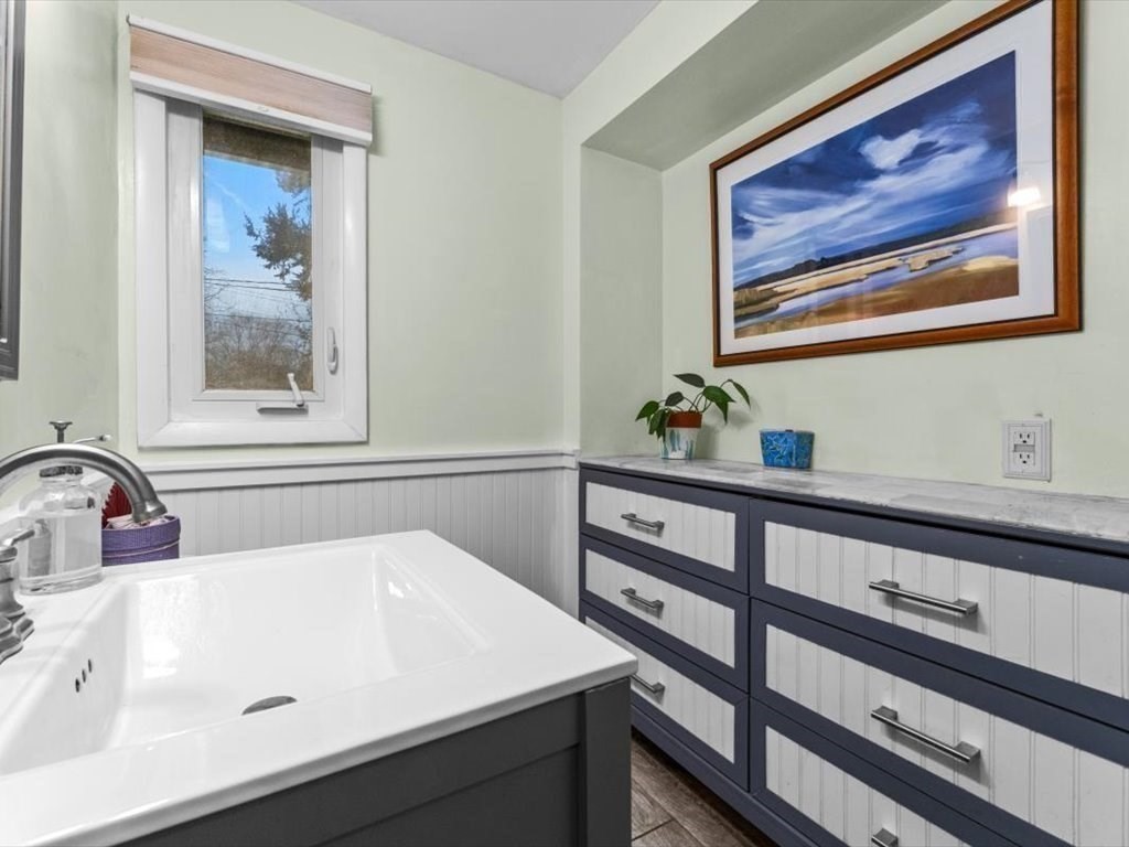 15 Rosslare Road Framingham, MA 01701 - Photo 30 of 37 a bathroom with a sink and a mirror