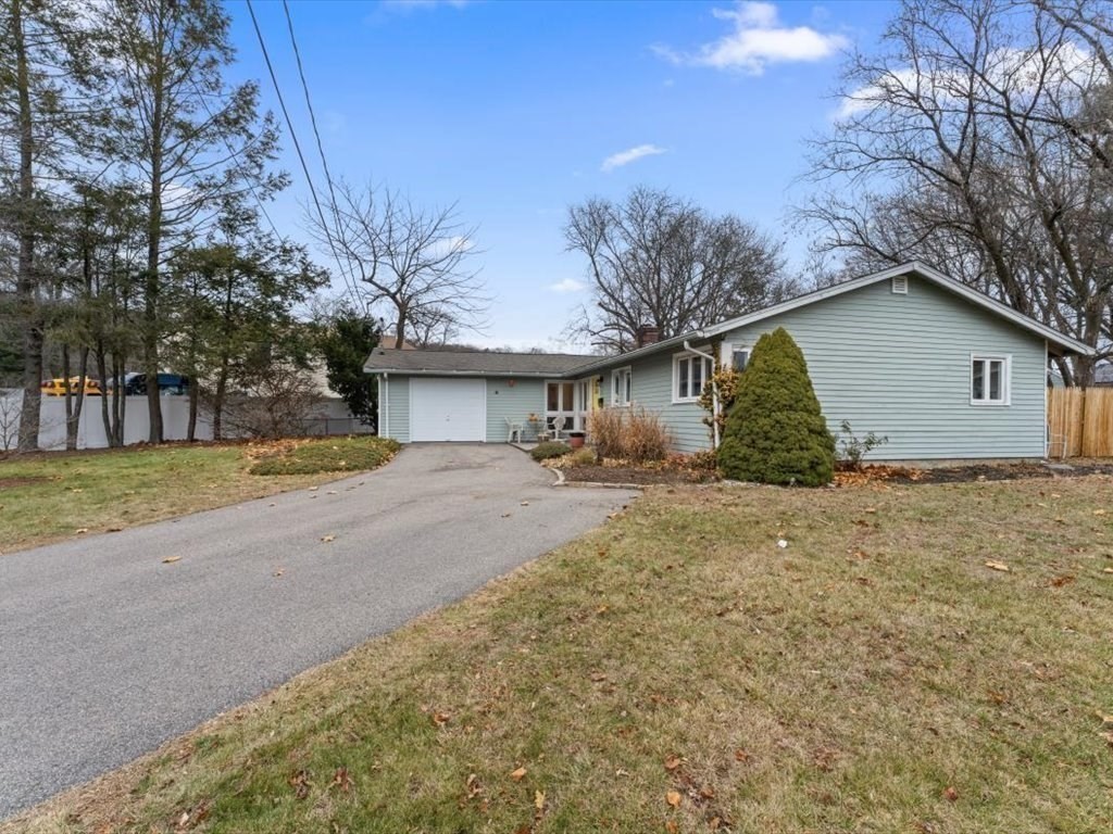 15 Rosslare Road Framingham, MA 01701 - Photo 4 of 37 a view of a house with a yard and garage