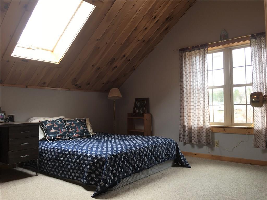 570 Monroe Road Winterport, ME 04496 - Photo 17 of 33 Upstairs bedroom with skylight and...