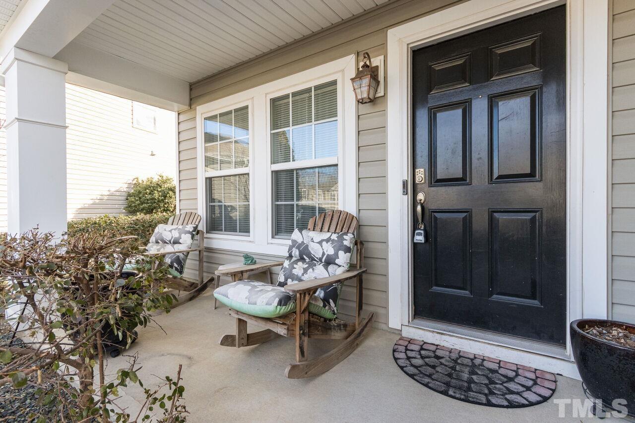 6122 Ricker Road Raleigh, NC 27610 - Photo 1 of 20 a outdoor living space with furniture and a potted plant