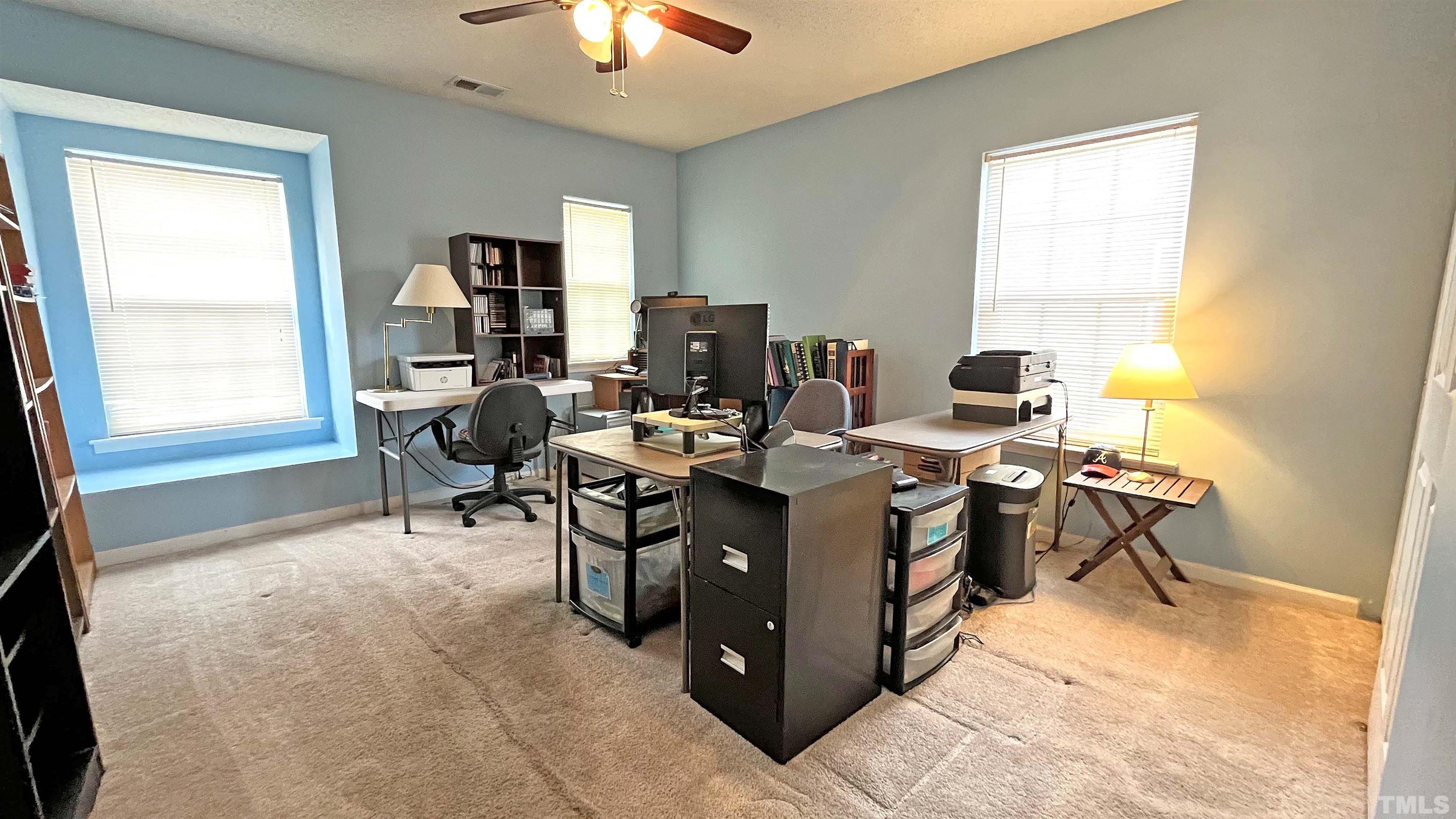 6122 Ricker Road Raleigh, NC 27610 - Photo 13 of 20 a view of a workspace with a window