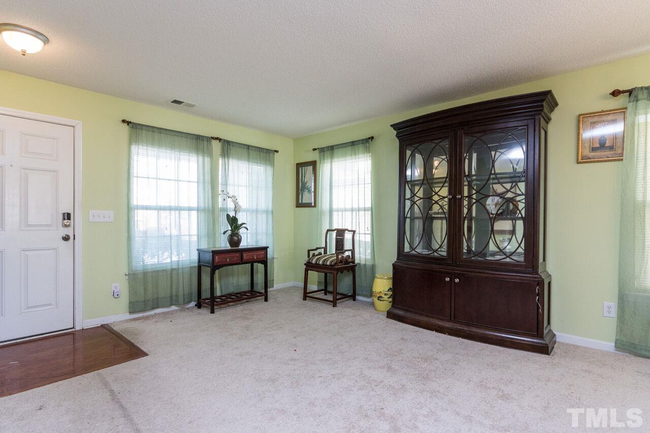 6122 Ricker Road Raleigh, NC 27610 - Photo 3 of 20 a living room with furniture and a window