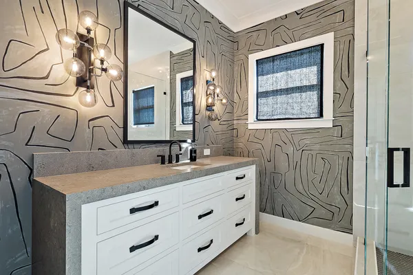 en suite bathroom with a tub and window