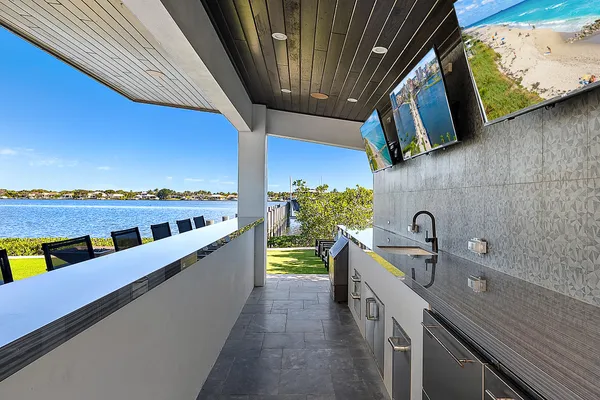 a view of house with swimming pool outdoor seating