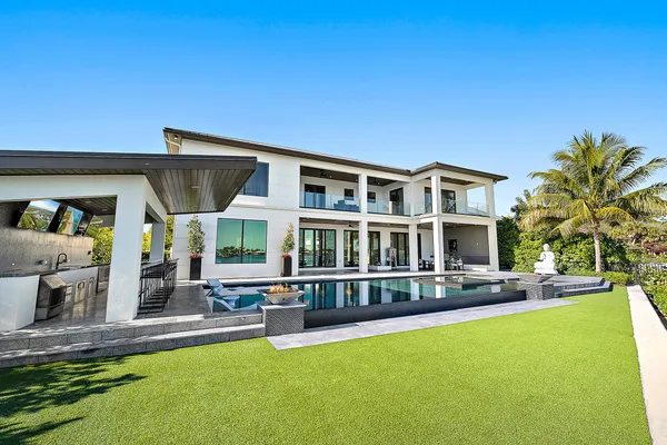 a view of swimming pool outdoor seating and city view