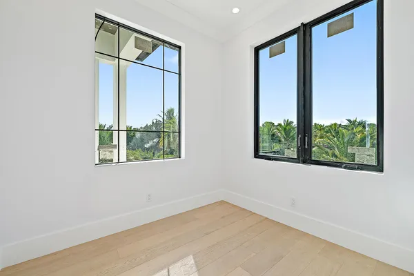 an aerial view of a house with a lake view