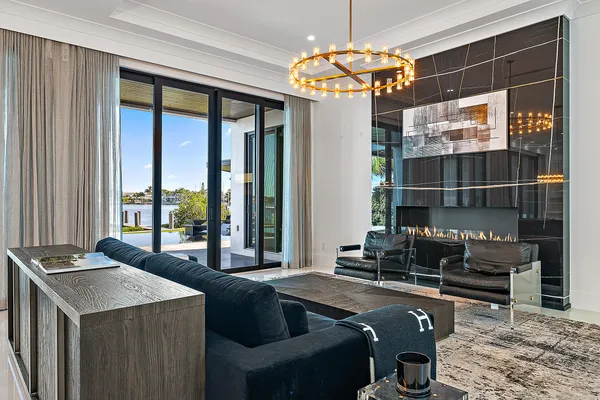 a kitchen with a table chairs stove and granite counter top