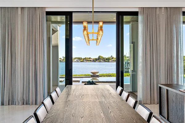 a view of a balcony with a table and chairs