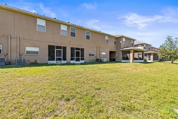 a house view with swimming pool in front of it