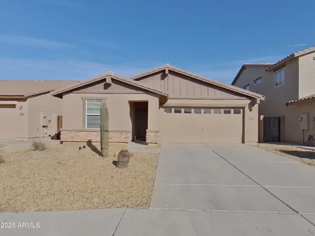 a view of a house with a snow in the background