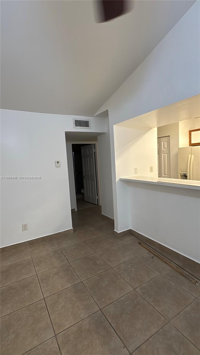 15320 Southwest 106th Terrace, Unit 1118 Miami, FL 33196 - Photo 12 of 25 a view of an empty room with a window