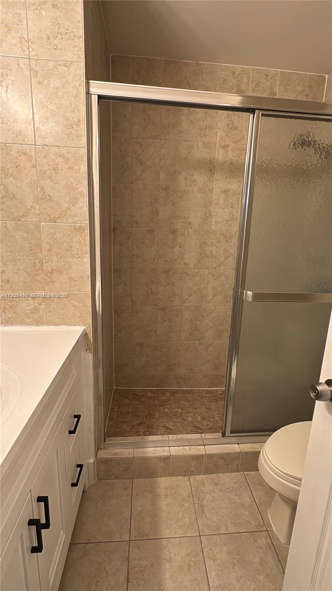 15320 Southwest 106th Terrace, Unit 1118 Miami, FL 33196 - Photo 14 of 25 a bathroom with a shower and a toilet