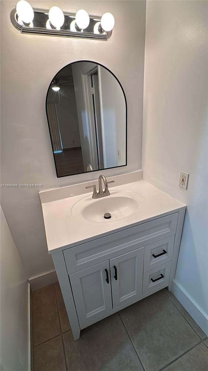 15320 Southwest 106th Terrace, Unit 1118 Miami, FL 33196 - Photo 18 of 25 a bathroom with a sink and a mirror