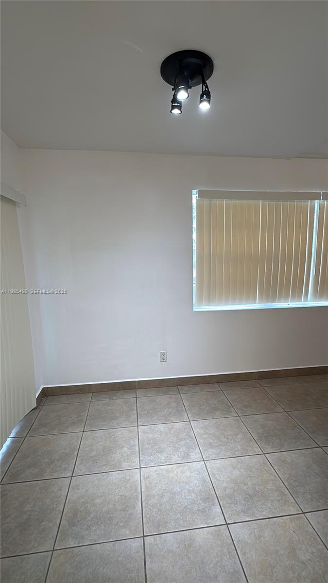 15320 Southwest 106th Terrace, Unit 1118 Miami, FL 33196 - Photo 8 of 25 a view of an empty room with a window