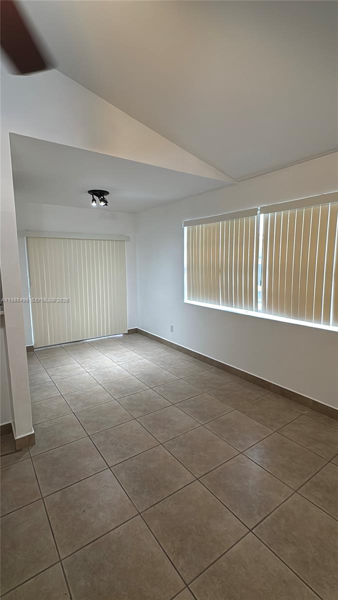 15320 Southwest 106th Terrace, Unit 1118 Miami, FL 33196 - Photo 9 of 25 a view of an empty room with a window