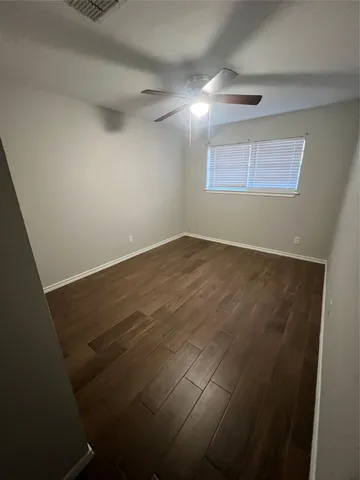 an empty room with a empty space and windows