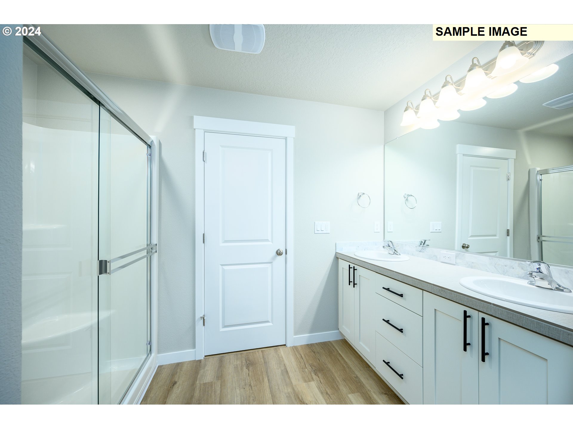 10572 Southeast Heritage Road, Unit 308 Happy Valley, OR 97086 - Photo 14 of 22 a bathroom with a double vanity sink mirror and shower