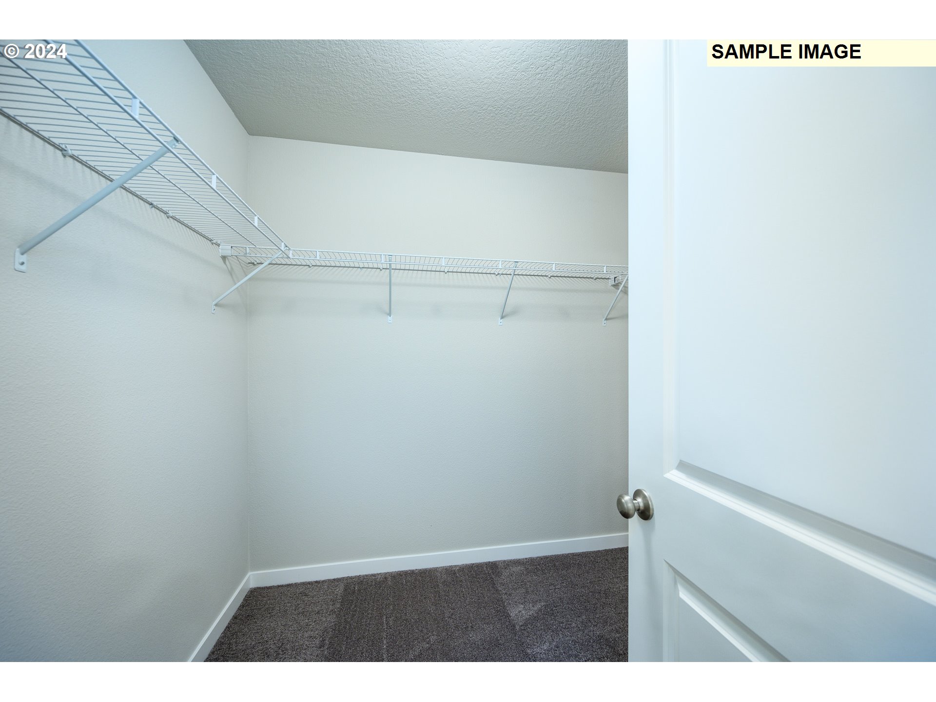 10572 Southeast Heritage Road, Unit 308 Happy Valley, OR 97086 - Photo 15 of 22 a view of an empty walk in closet