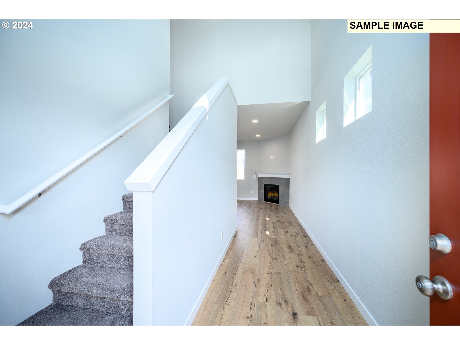 10572 Southeast Heritage Road, Unit 308 Happy Valley, OR 97086 - Photo 19 of 22 a view of entryway and hall with wooden floor