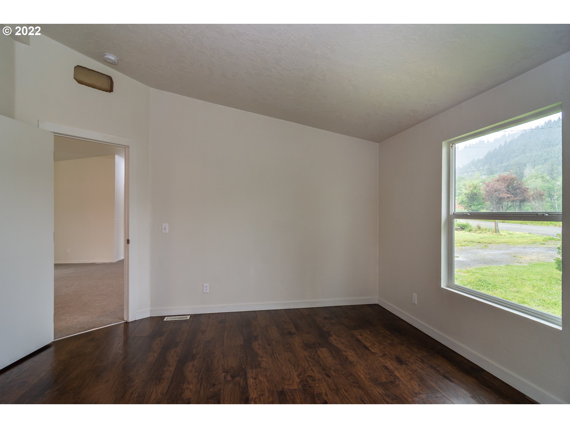 692 Mathis Hill Road Yoncalla, OR 97499 - Photo 17 of 31 a view of an empty room and window